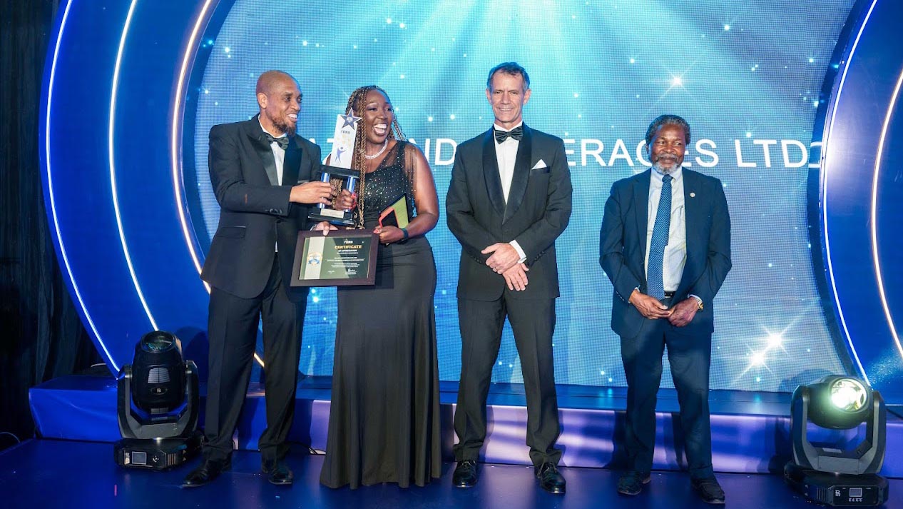 Best of the best, Eswatini Beverages Country Director Doreen Tumureebire receiving her company's award for Overall Highest Compliant from Commissioner General Brightwell Nkambule, while Finance Minister Neal Rijkenberg and Governing Board Chairperson David Dlamini look on. This was during the ERS Client Appreciation even at the Happy Valley Hotel on Friday. (Courtesy Pics)